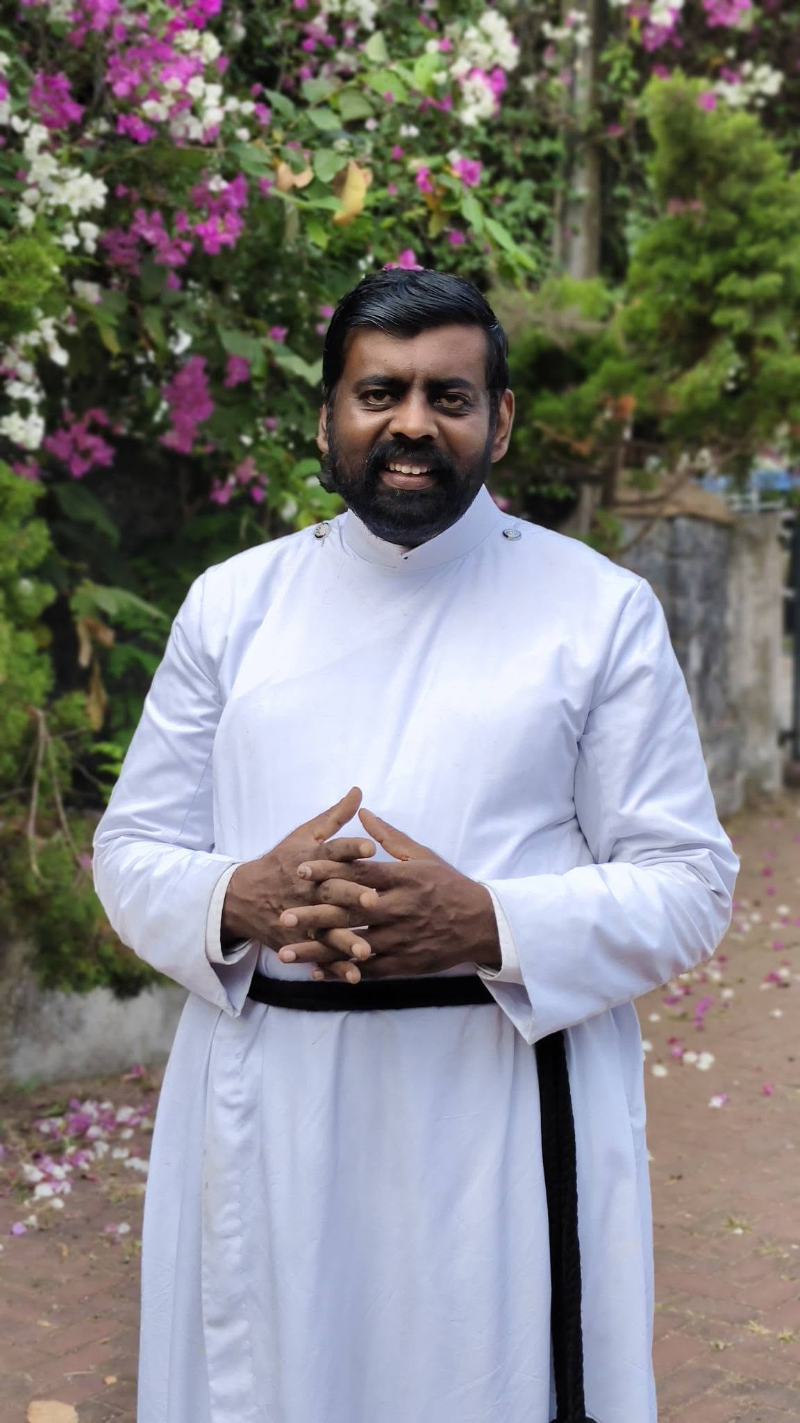 Rev. Dr. Adv. Stephens Justin Raj outdoors